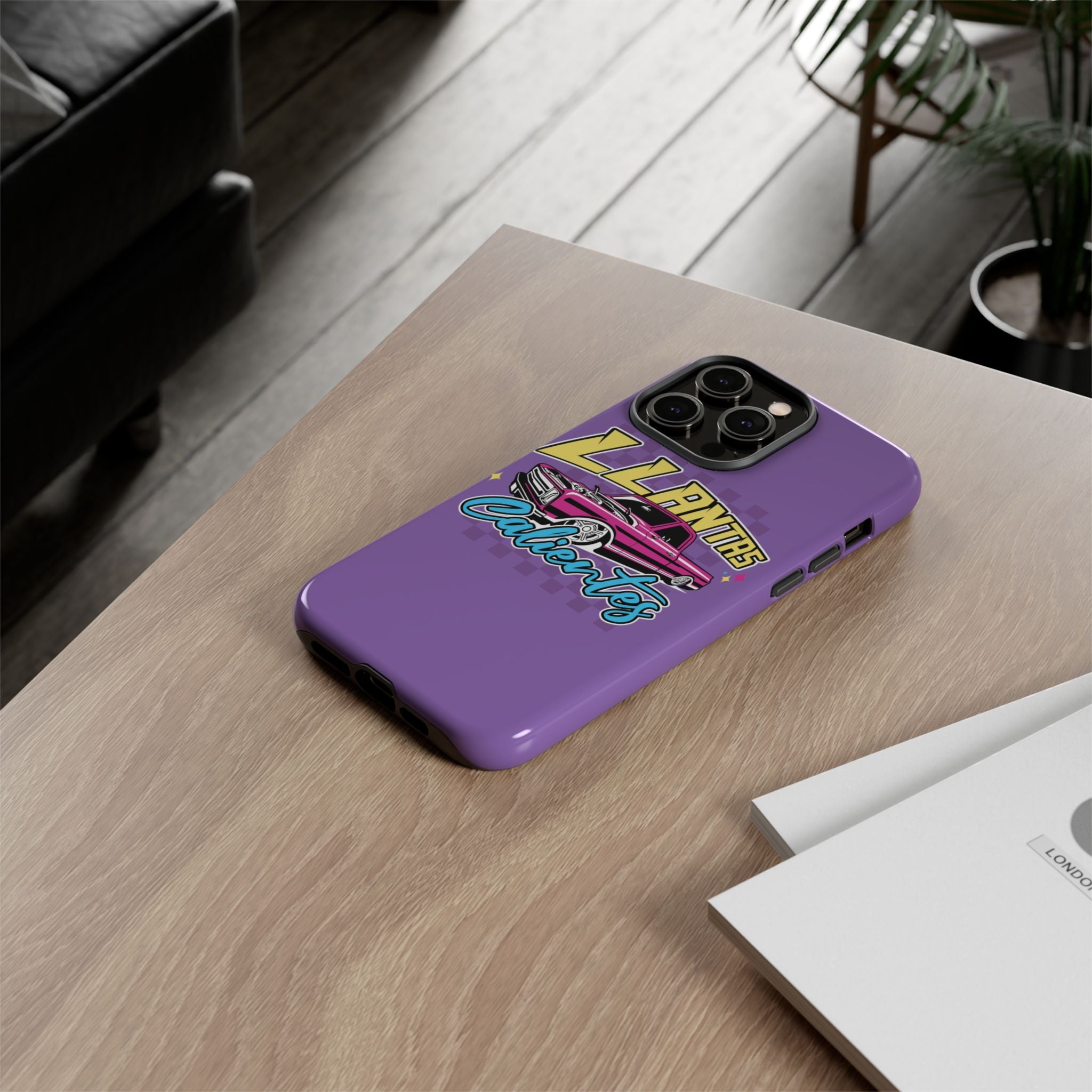 Stylish purple iPhone case with bold Llantas Calientes graphic
