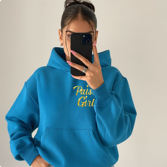 Latina couture model in paisa girl sweater hoodie with hood down.