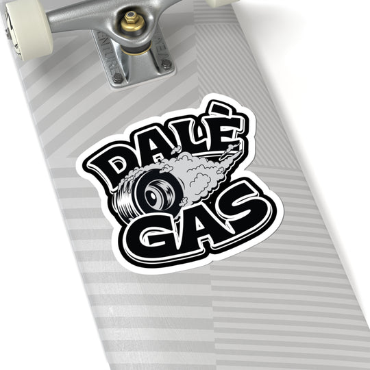 Skateboard with a 'Dalé Gas' sticker on a white background
