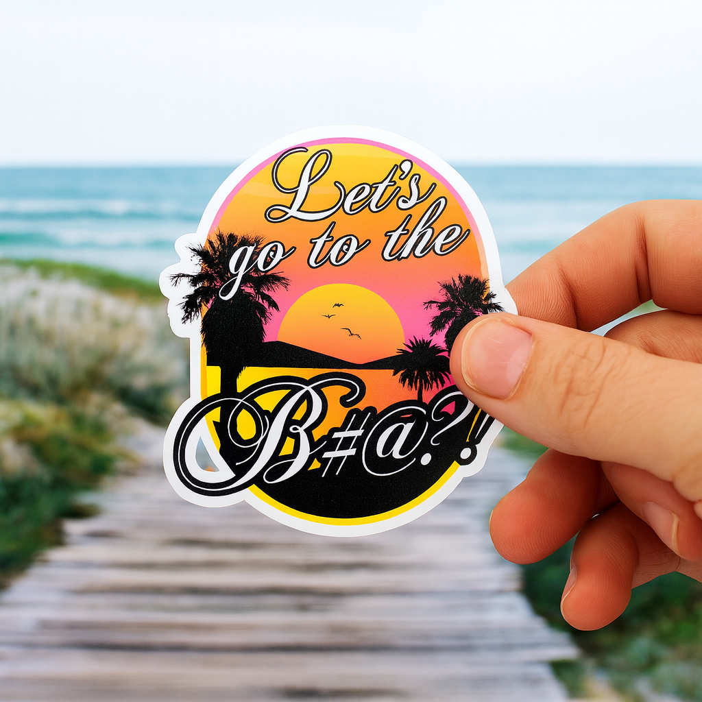 lets go to the bitch sticker held in hand with beach sunset background.