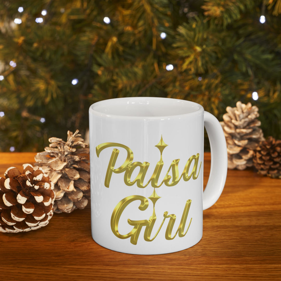 Editorial close-up of Paisa Girl Ceramic mug with gold lettering design.