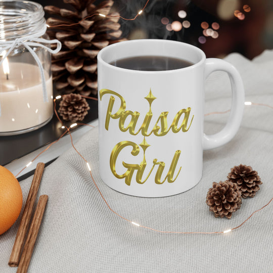 Paisa Girl Ceramic mug with gold lettering styled in cozy lifestyle shot.